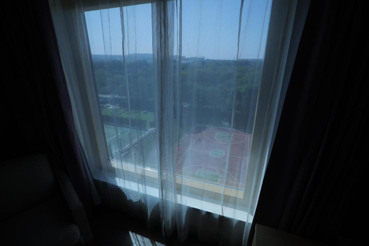 a window in a hotel room with a view at Novotel Hyderabad Airport in Hyderabad