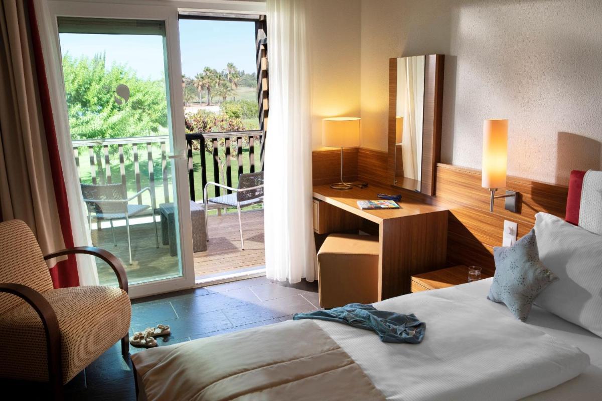 Uma cama ou camas num quarto em ROBINSON QUINTA DA RIA - All Inclusive