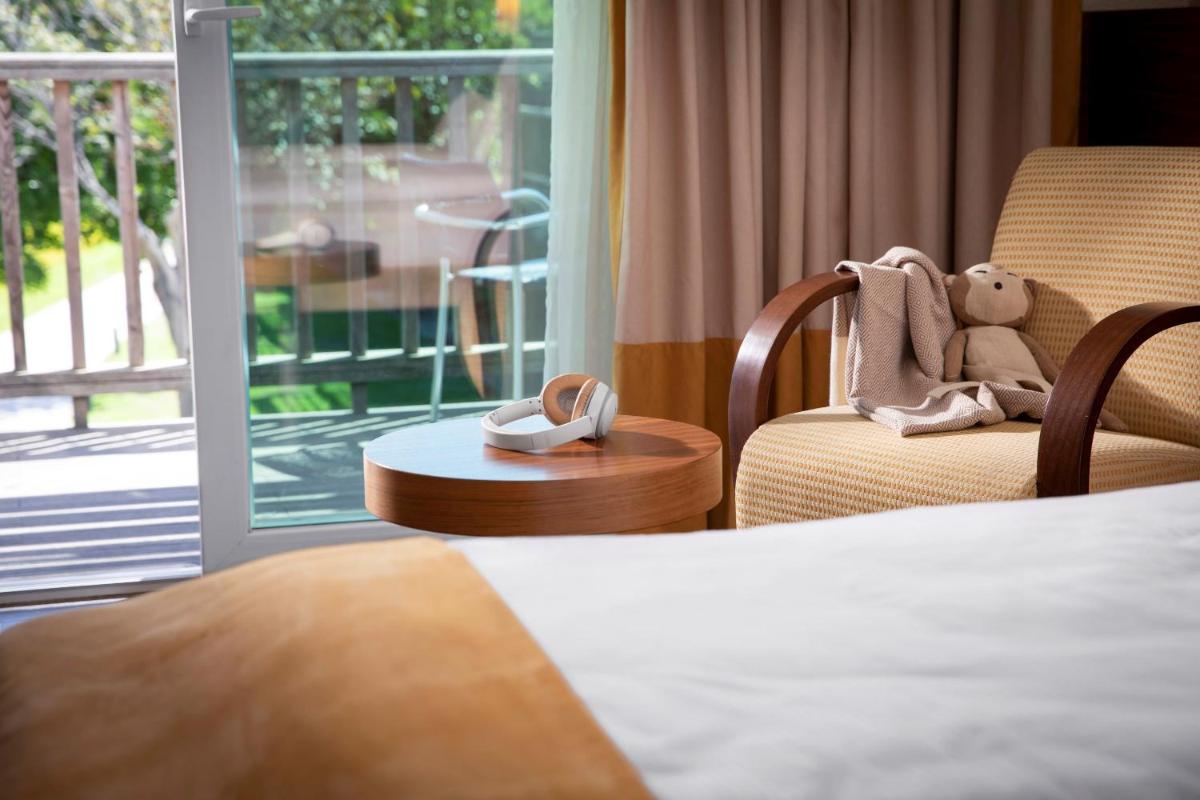 Uma cama ou camas num quarto em ROBINSON QUINTA DA RIA - All Inclusive