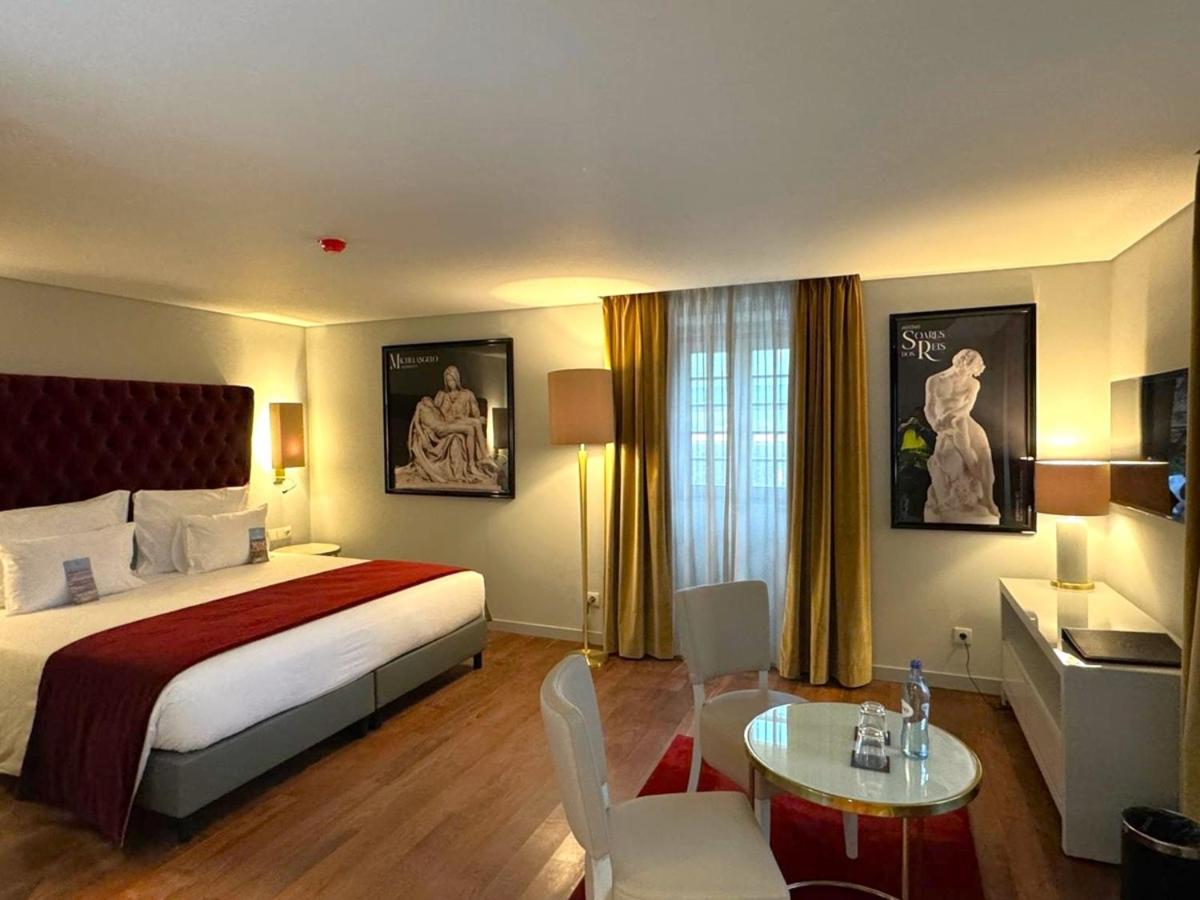 Uma cama ou camas num quarto em Vila Gale Collection Ponte de Lima