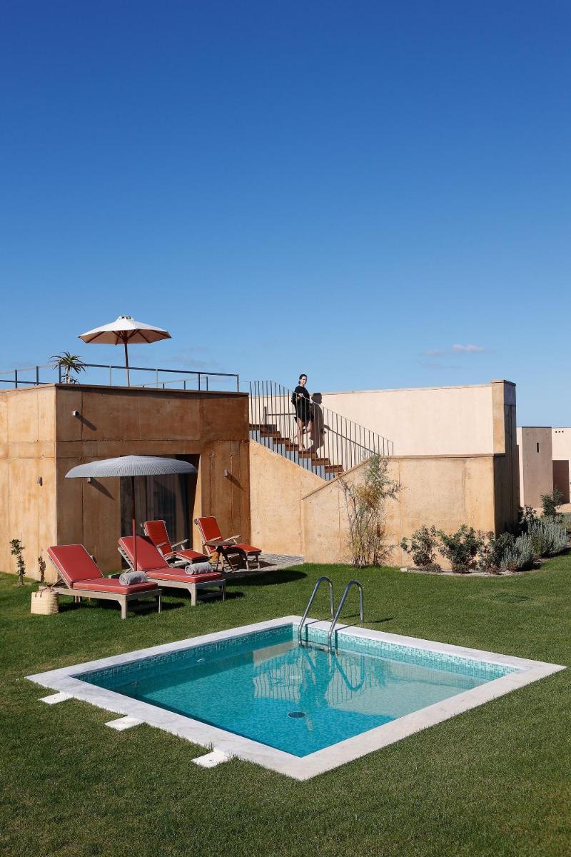 uma piscina no quintal de uma casa em Praia do Canal Nature Retreat - Small Luxury Hotels of the World em Aljezur