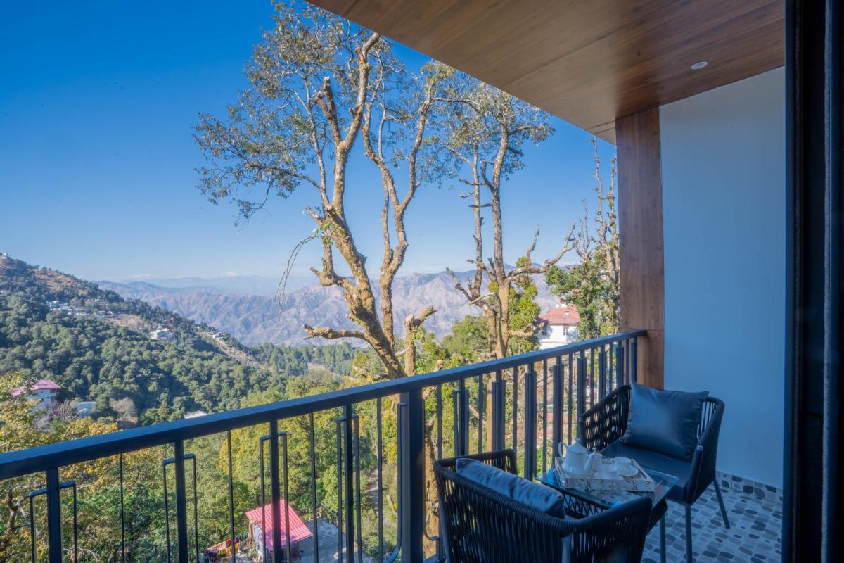 a balcony with a view of the mountains at Perfectstayz Premium Westend at Mall Road in Mussoorie