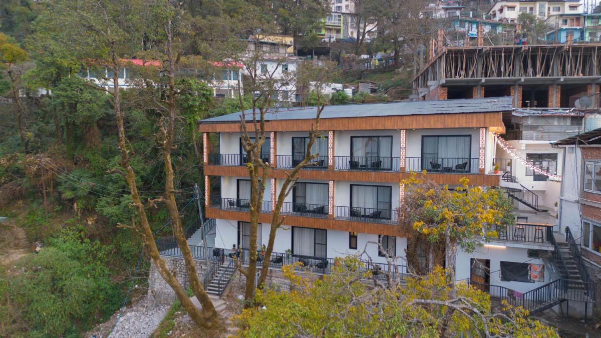 an apartment building on the side of a mountain at Perfectstayz Premium Westend at Mall Road in Mussoorie
