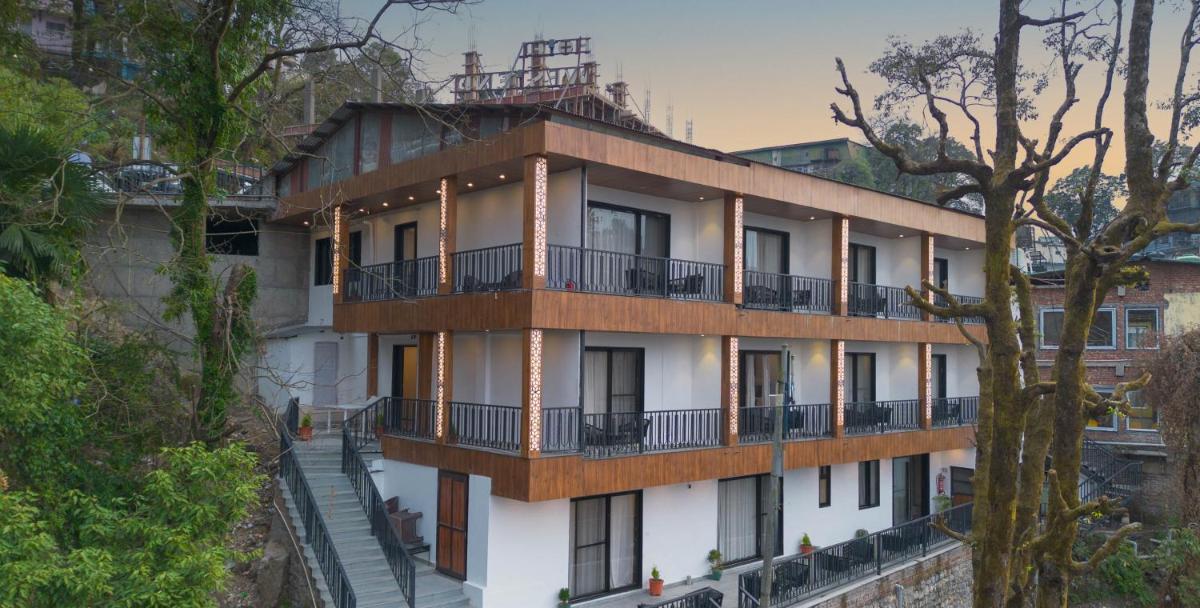 a building with balconies on the side of it at Perfectstayz Premium Westend at Mall Road in Mussoorie