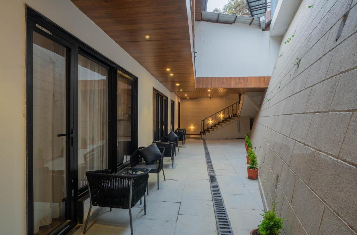 a row of chairs in a hallway of a building at Perfectstayz Premium Westend at Mall Road in Mussoorie