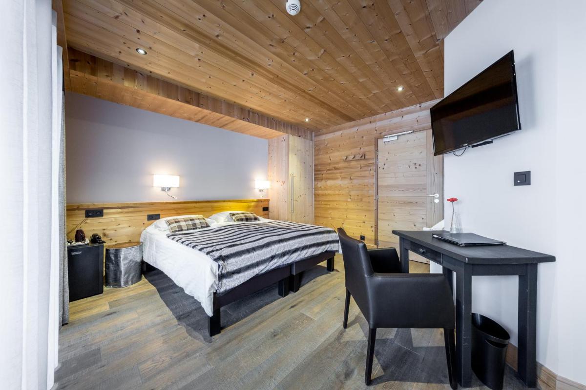 Un ou plusieurs lits dans un hébergement de l'établissement Logis Hotel Gai Soleil