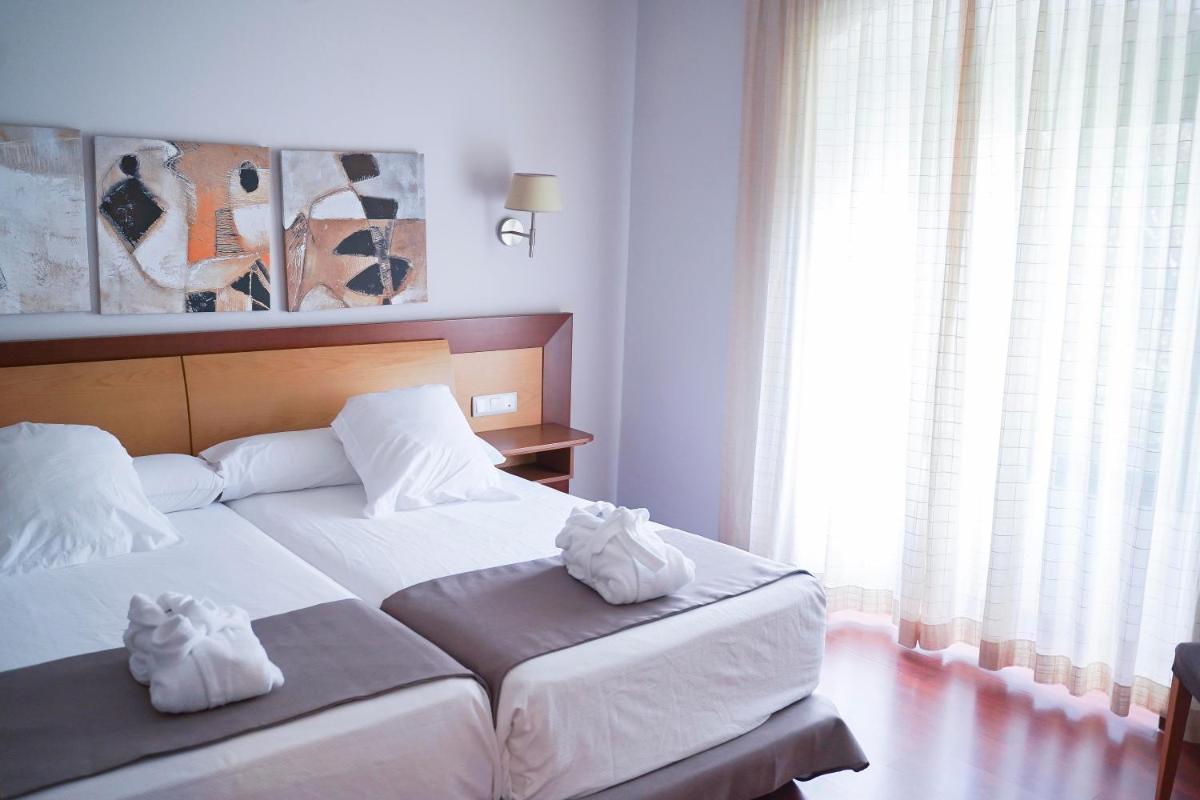 Cama o camas de una habitación en Salugral Termal Resort
