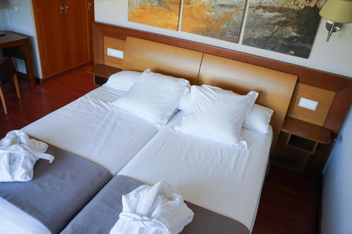 Cama o camas de una habitación en Salugral Termal Resort