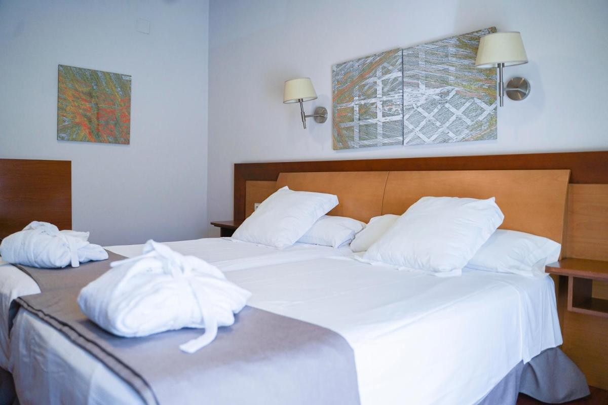 Cama o camas de una habitación en Salugral Termal Resort