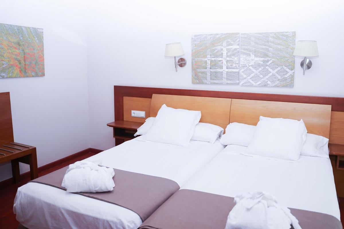 Cama o camas de una habitación en Salugral Termal Resort