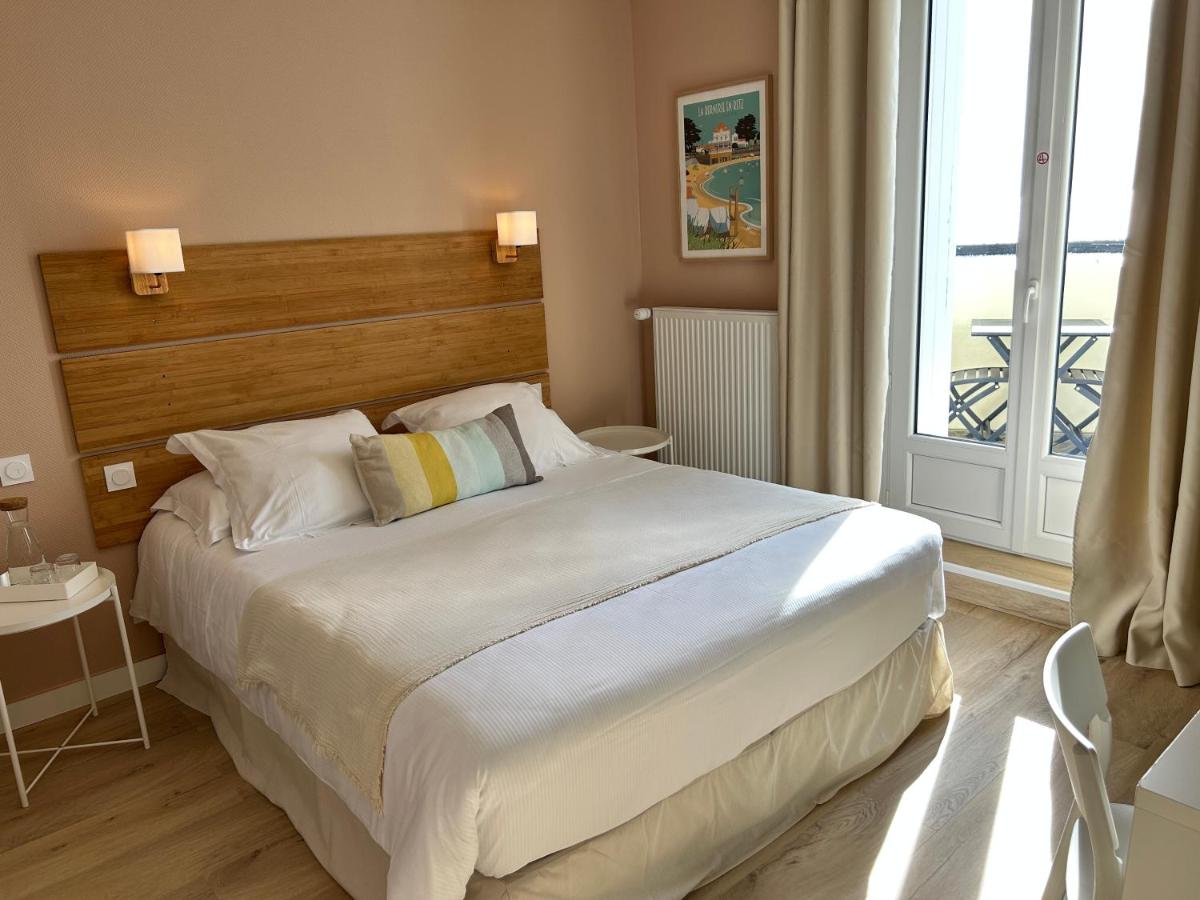 Un ou plusieurs lits dans un hébergement de l'établissement Hôtel de charme & SPA Le Grand Large