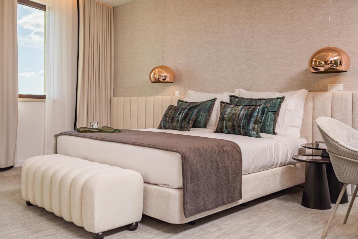 Uma cama ou camas num quarto em Haven Nature Hotel & Villas