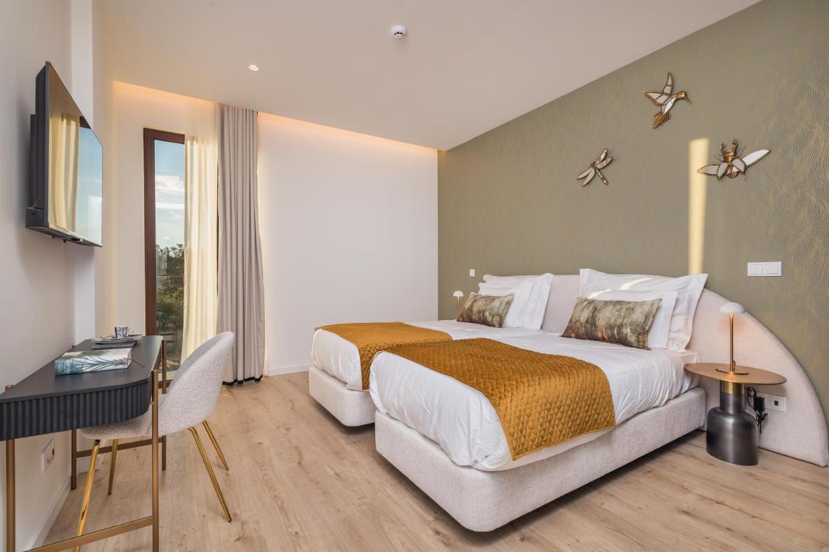 Uma cama ou camas num quarto em Haven Nature Hotel & Villas