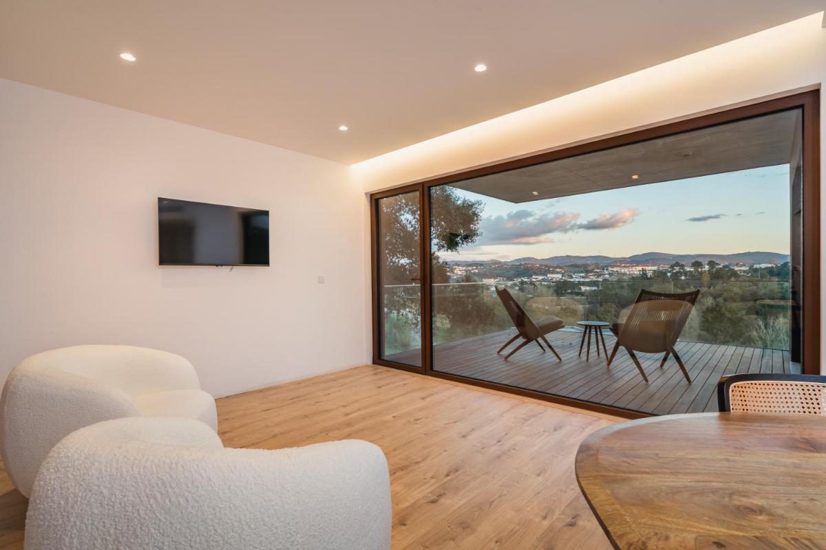 Uma televisão e/ou sistema de entretenimento em Haven Nature Hotel & Villas