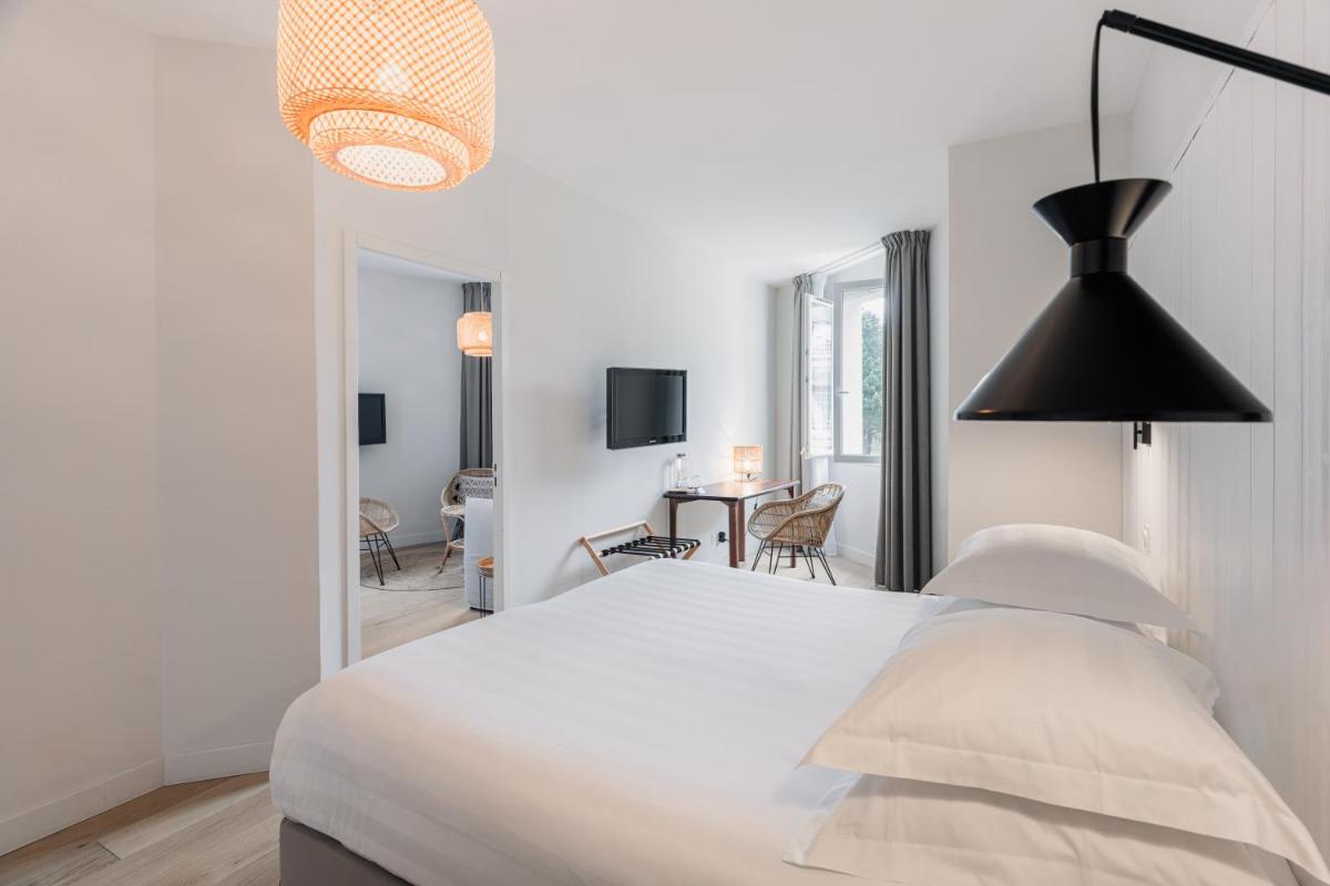 Un ou plusieurs lits dans un hébergement de l'établissement Hotel De Diane
