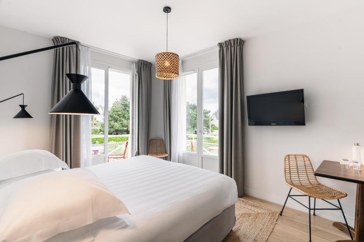 Un ou plusieurs lits dans un hébergement de l'établissement Hotel De Diane