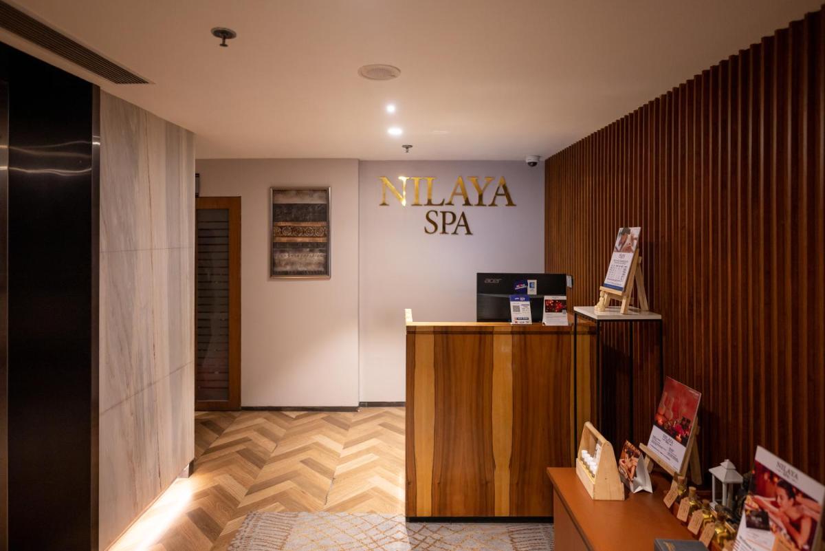 a lobby with a niya sa sign on a wall at Courtyard by Marriott Amritsar in Amritsar