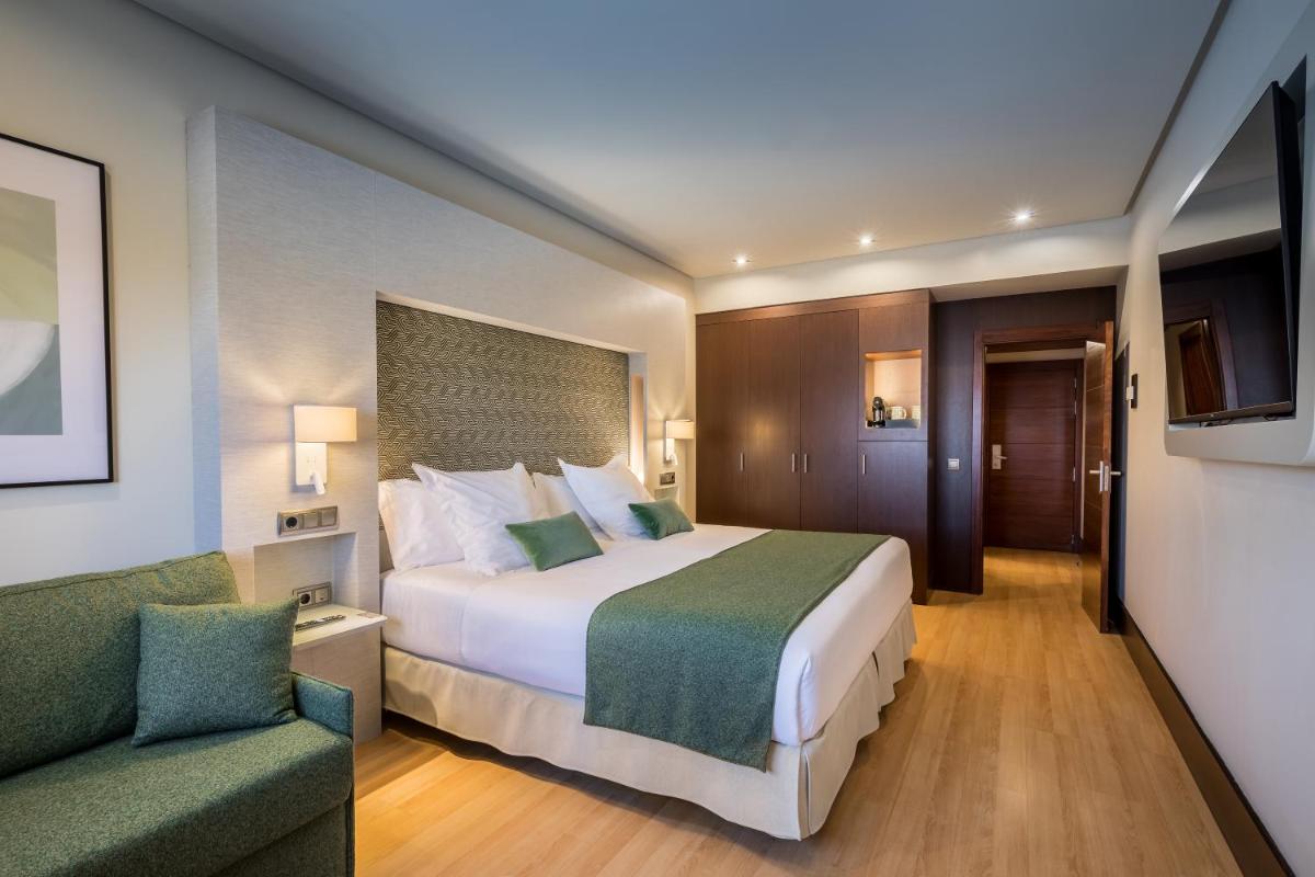 Cama o camas de una habitación en Barceló Granada Congress