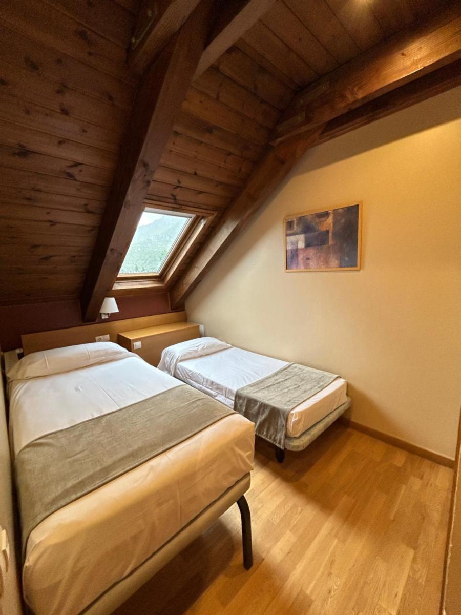 Cama o camas de una habitación en Aparthotel Siente Boí & SPA