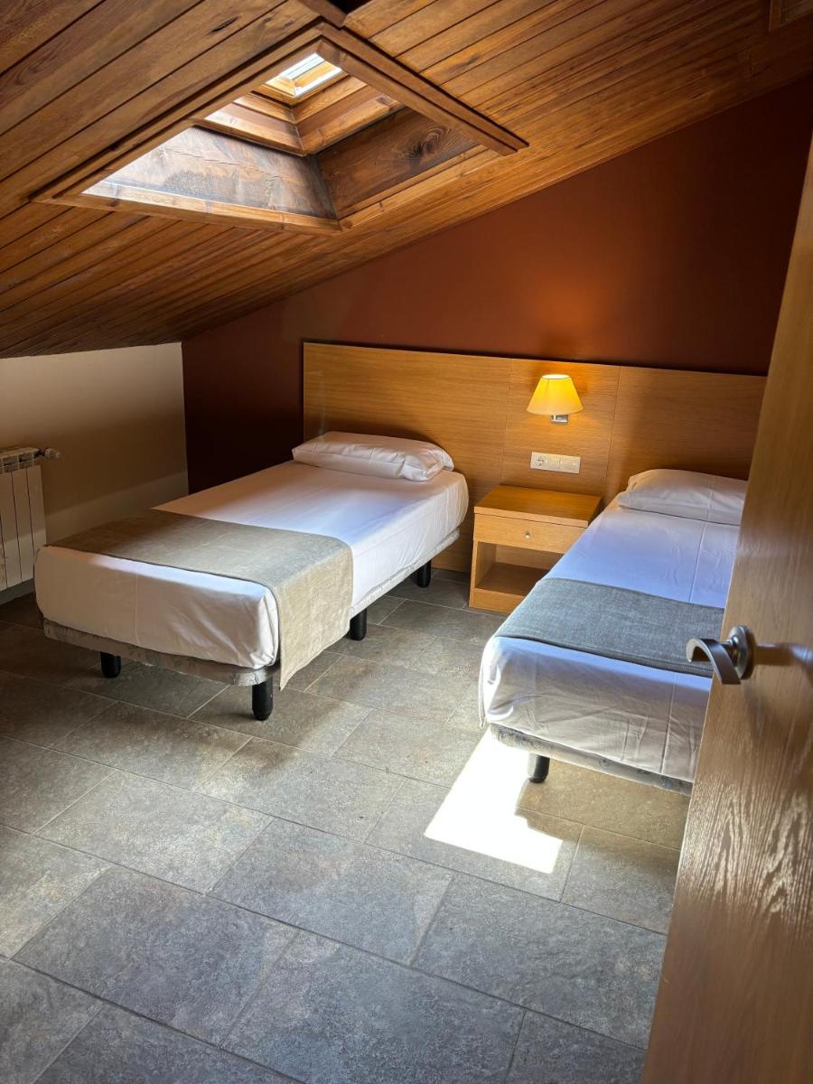 Cama o camas de una habitación en Aparthotel Siente Boí & SPA