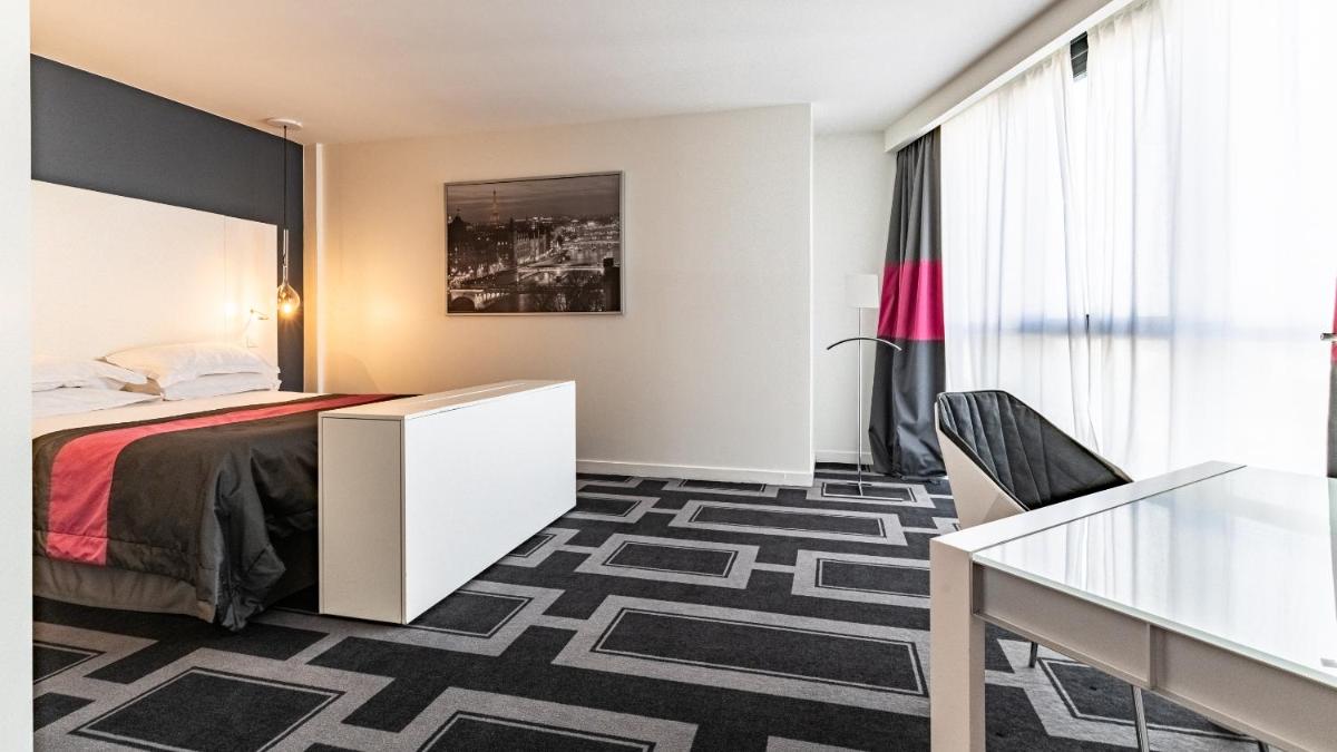 Un ou plusieurs lits dans un hébergement de l'établissement Holiday Inn Dijon Toison D'or by IHG