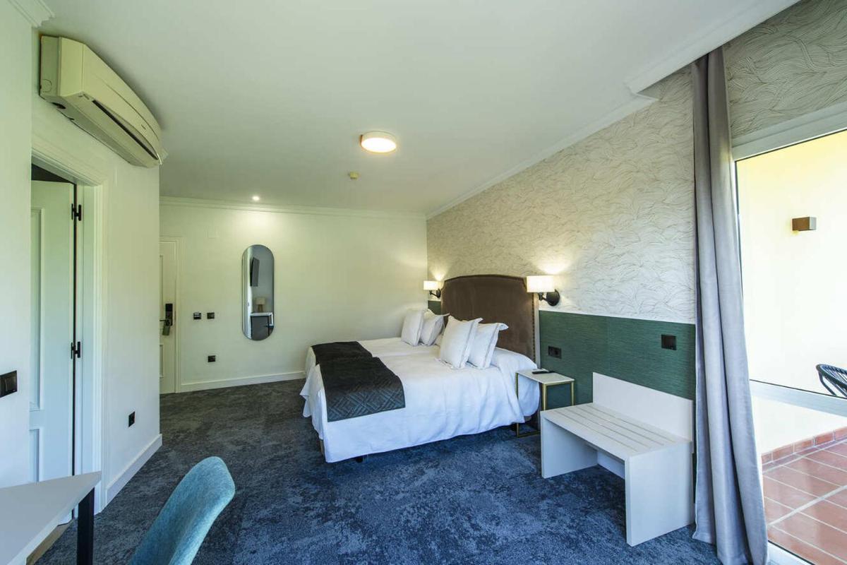 Cama o camas de una habitación en Hotel Tamisa Golf