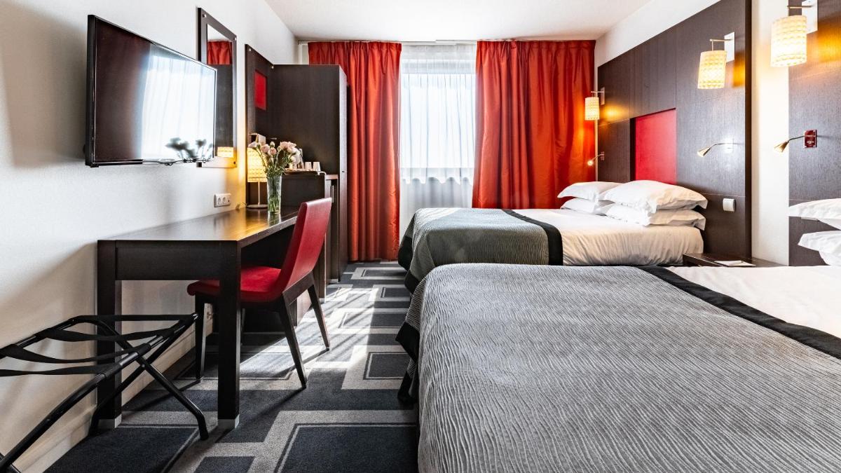 Un ou plusieurs lits dans un hébergement de l'établissement Holiday Inn Dijon Toison D'or by IHG