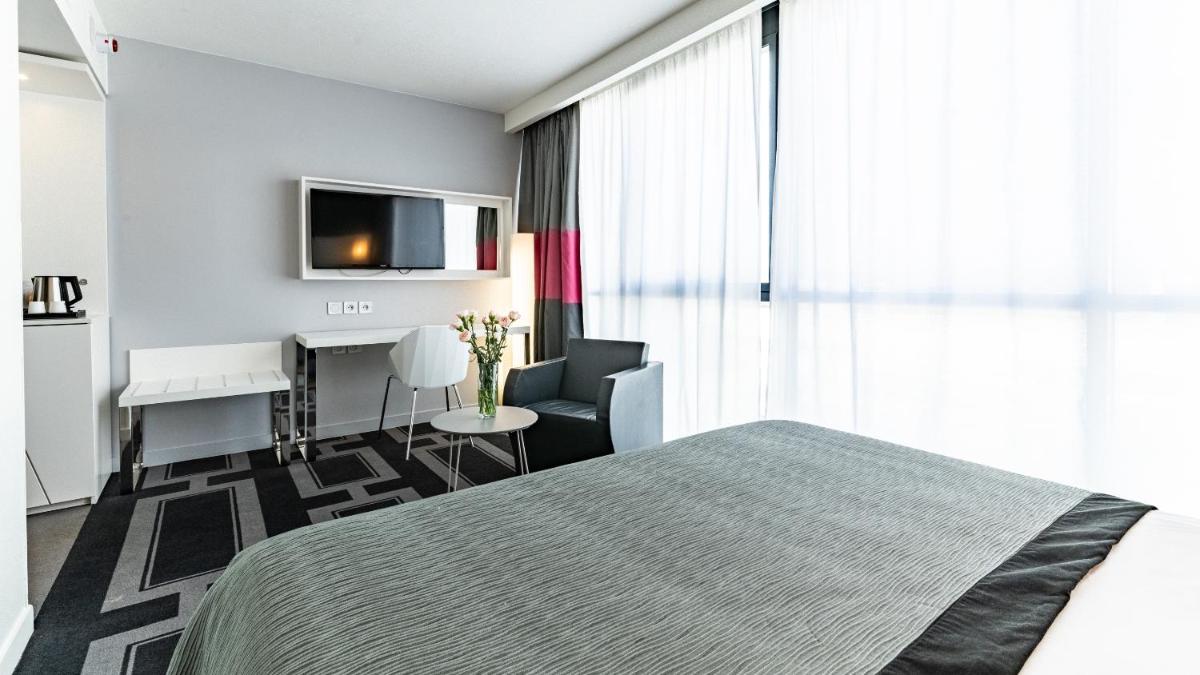 Un ou plusieurs lits dans un hébergement de l'établissement Holiday Inn Dijon Toison D'or by IHG