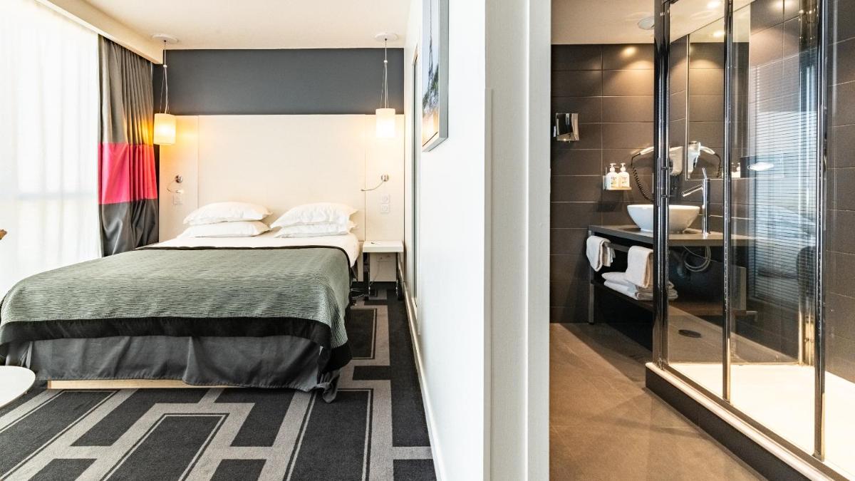 Un ou plusieurs lits dans un hébergement de l'établissement Holiday Inn Dijon Toison D'or by IHG