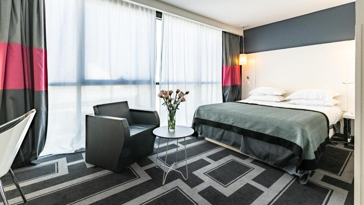 Un ou plusieurs lits dans un hébergement de l'établissement Holiday Inn Dijon Toison D'or by IHG