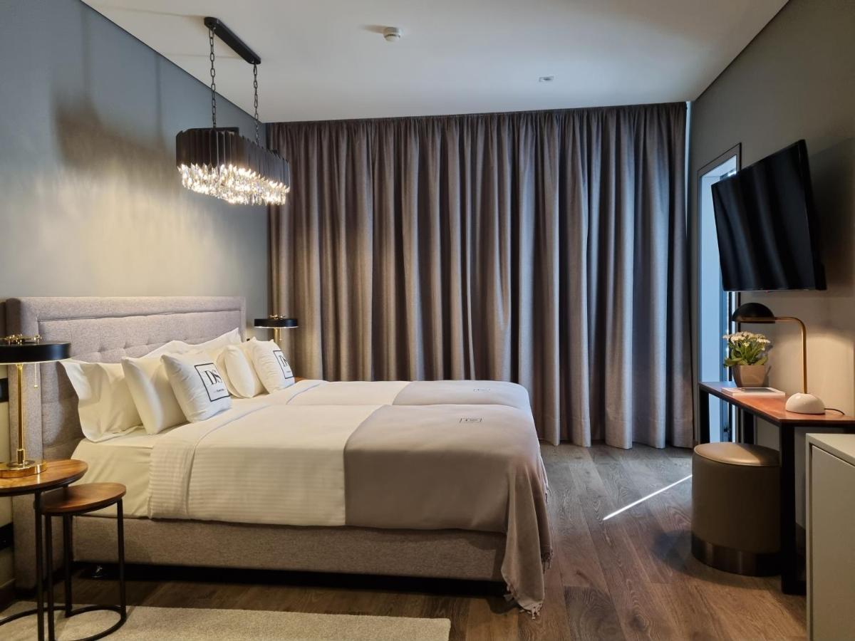 Uma cama ou camas num quarto em DS Hotel Lusopark