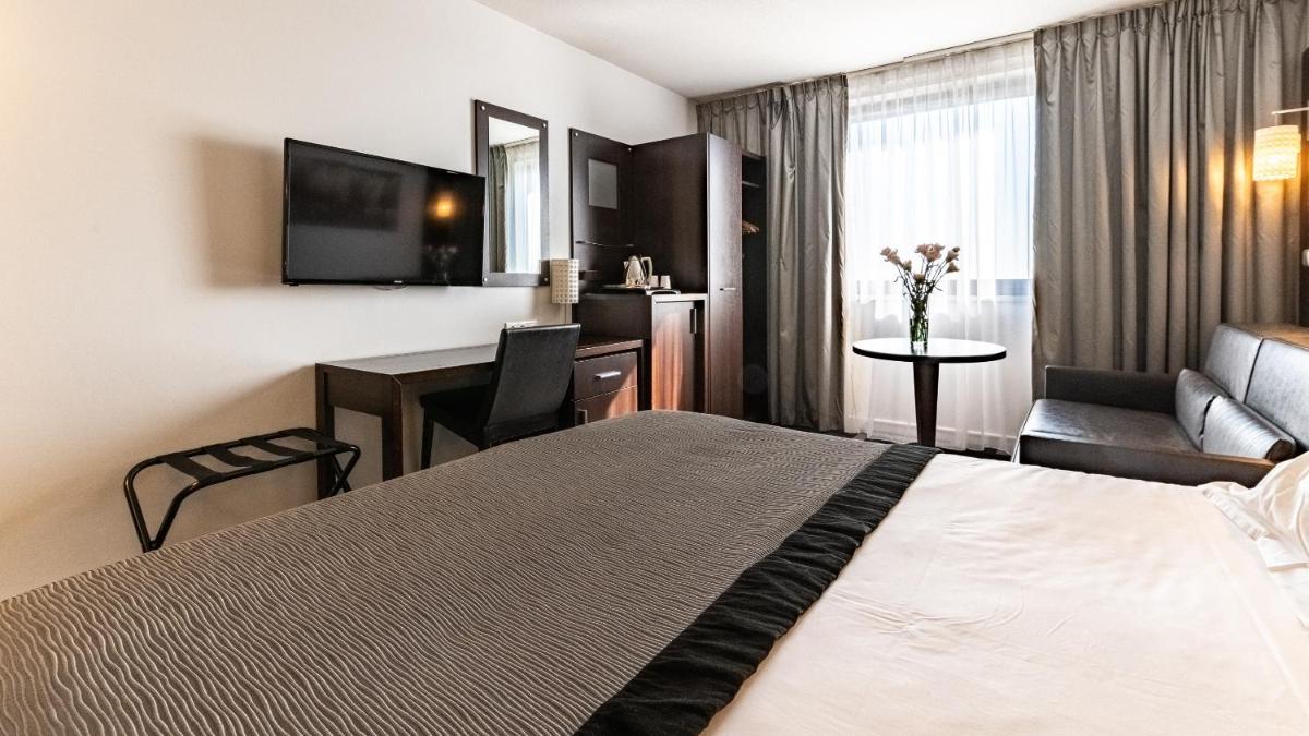 Un ou plusieurs lits dans un hébergement de l'établissement Holiday Inn Dijon Toison D'or by IHG