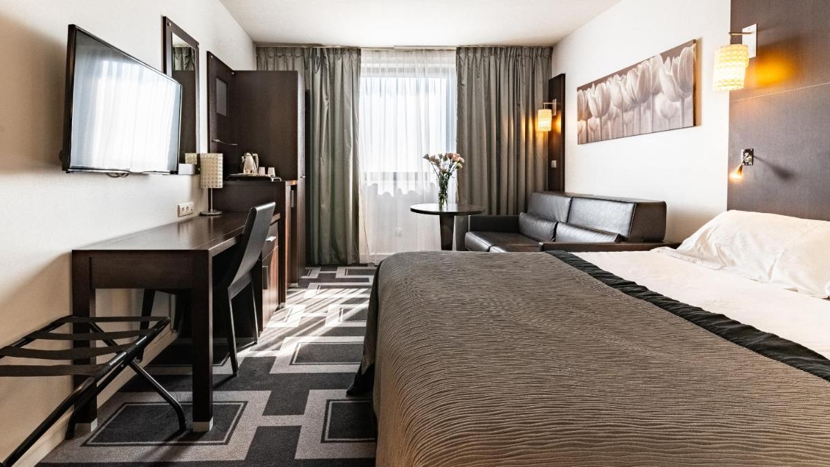 Un ou plusieurs lits dans un hébergement de l'établissement Holiday Inn Dijon Toison D'or by IHG