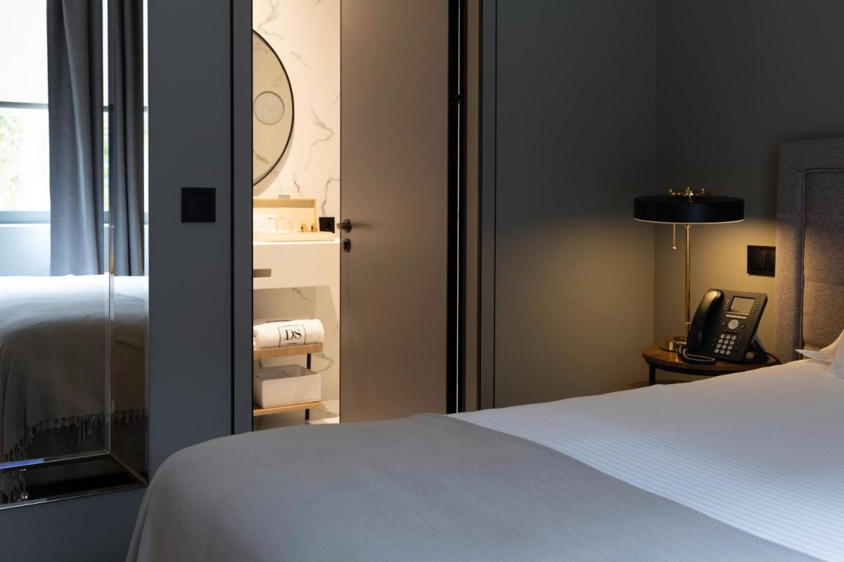 Uma cama ou camas num quarto em DS Hotel Lusopark