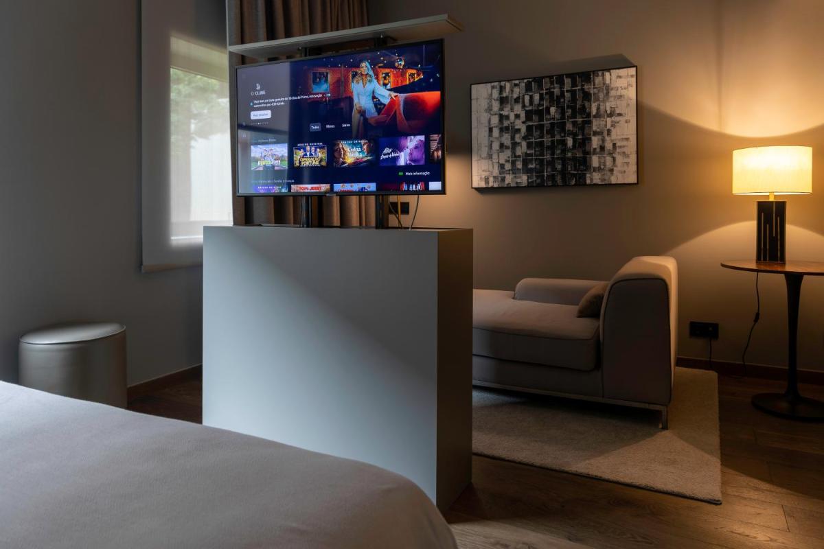 Uma cama ou camas num quarto em DS Hotel Lusopark