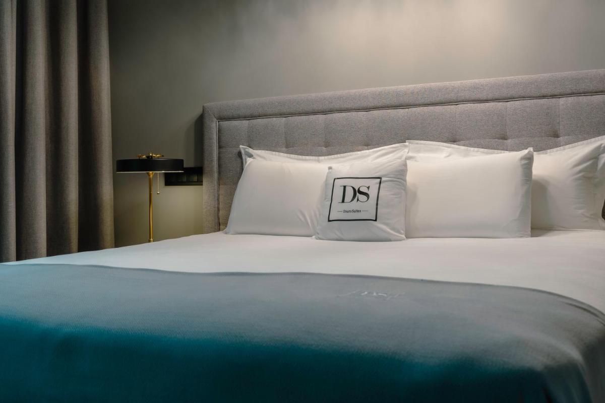 Uma cama ou camas num quarto em DS Hotel Lusopark