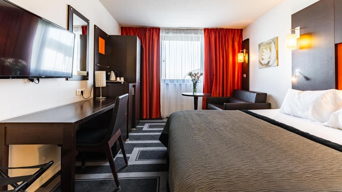 Un ou plusieurs lits dans un hébergement de l'établissement Holiday Inn Dijon Toison D'or by IHG