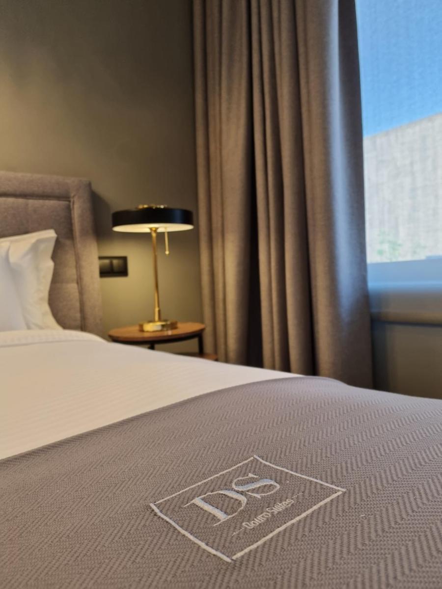 Uma cama ou camas num quarto em DS Hotel Lusopark
