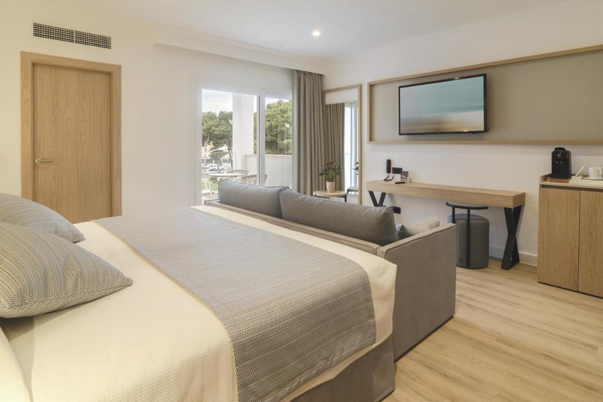Cama o camas de una habitación en Hotel Capricho
