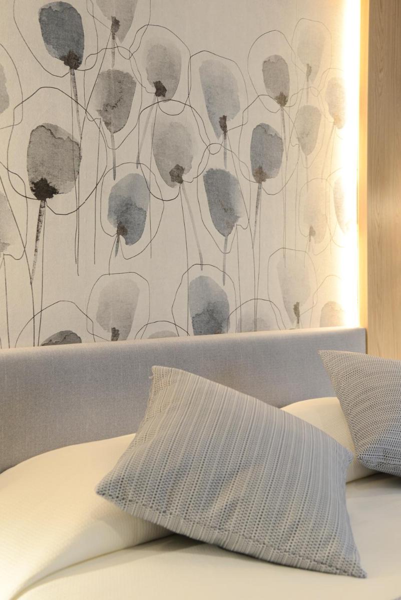 Cama o camas de una habitación en Hotel Capricho