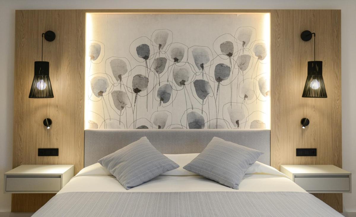 Cama o camas de una habitación en Hotel Capricho