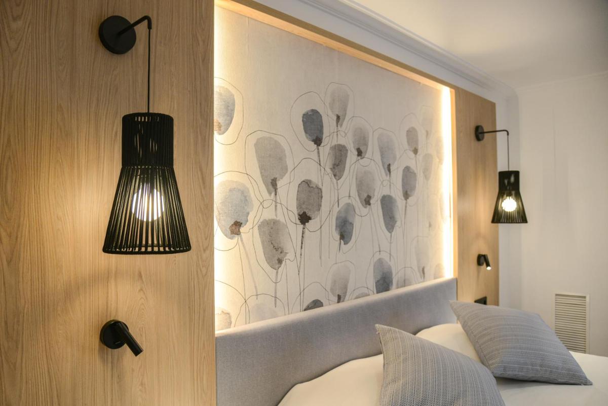 Cama o camas de una habitación en Hotel Capricho