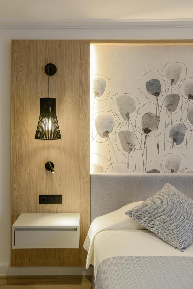 Cama o camas de una habitación en Hotel Capricho