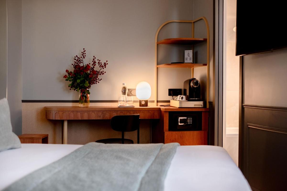 Un ou plusieurs lits dans un hébergement de l'établissement Grand Hotel Saint Michel