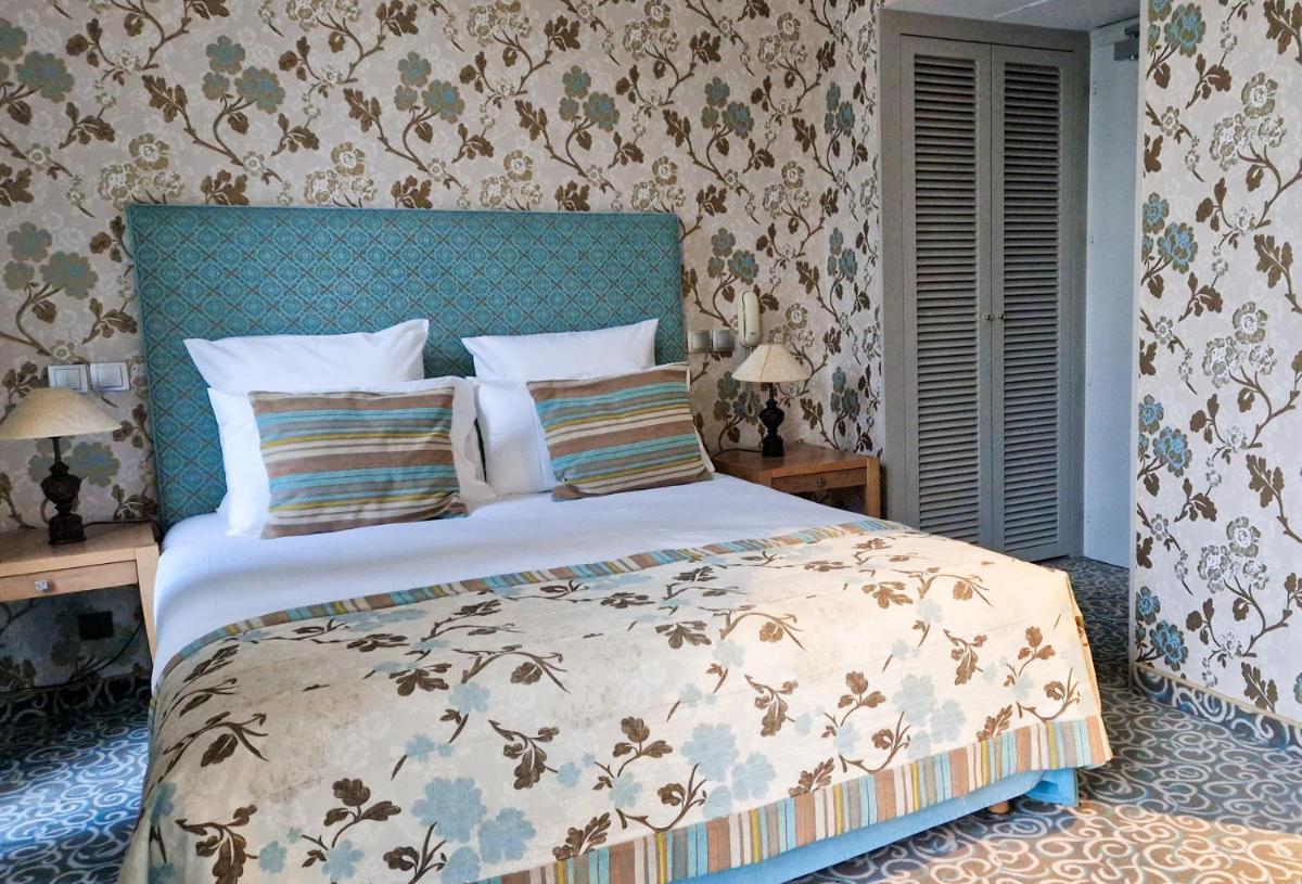 Un ou plusieurs lits dans un hébergement de l'établissement 6717 Nature Hôtel & Spa Le Clos des Délices