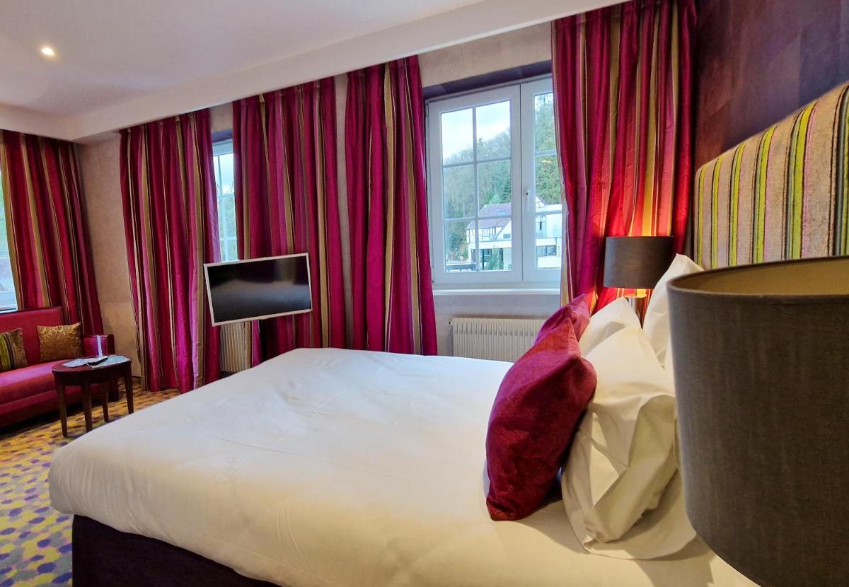 Un ou plusieurs lits dans un hébergement de l'établissement 6717 Nature Hôtel & Spa Le Clos des Délices