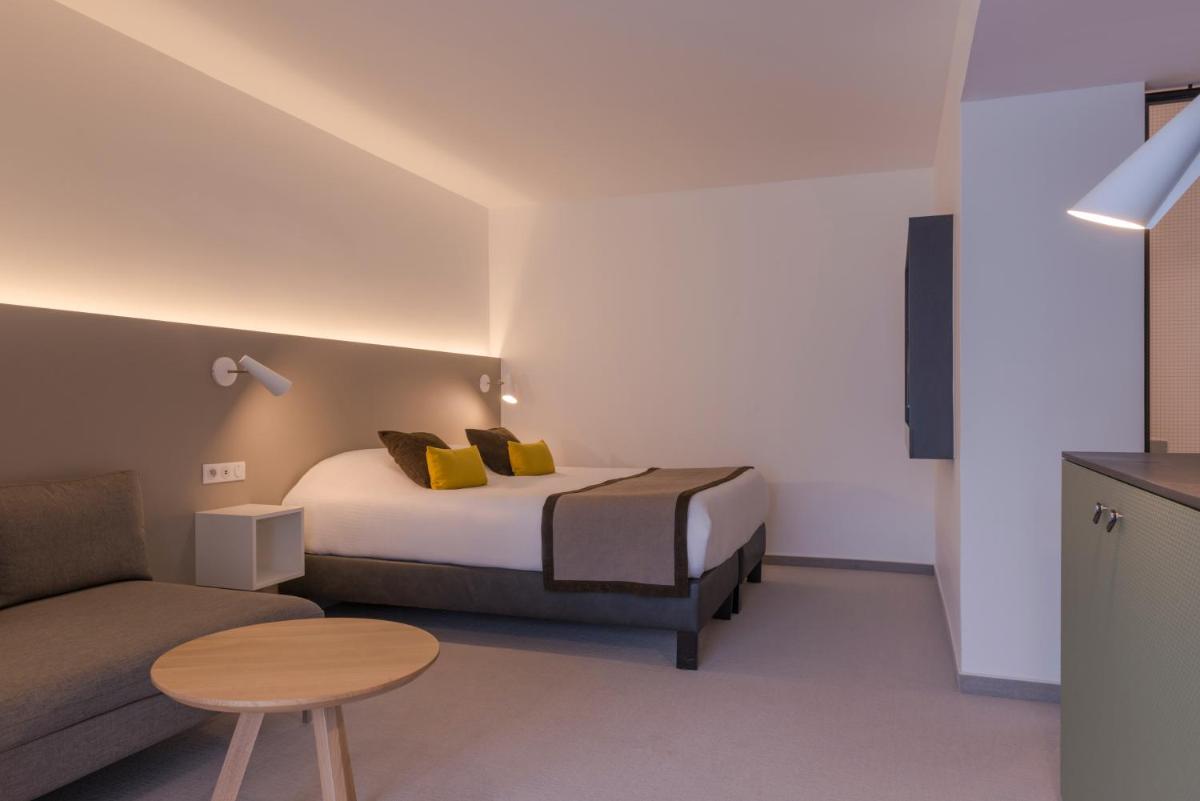 Un ou plusieurs lits dans un hébergement de l'établissement Hôtel Diana Restaurant & Spa by HappyCulture
