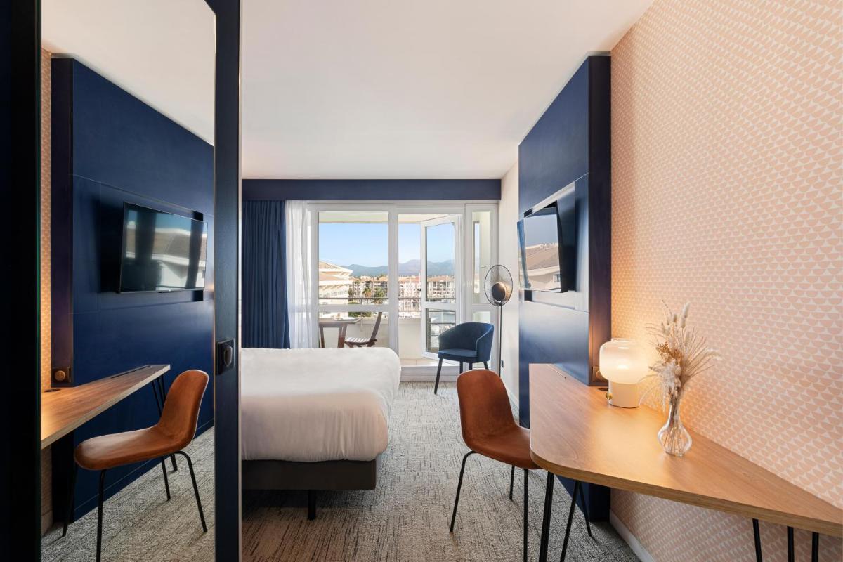 Un ou plusieurs lits dans un hébergement de l'établissement Mercure Thalasso & Spa Port Fréjus