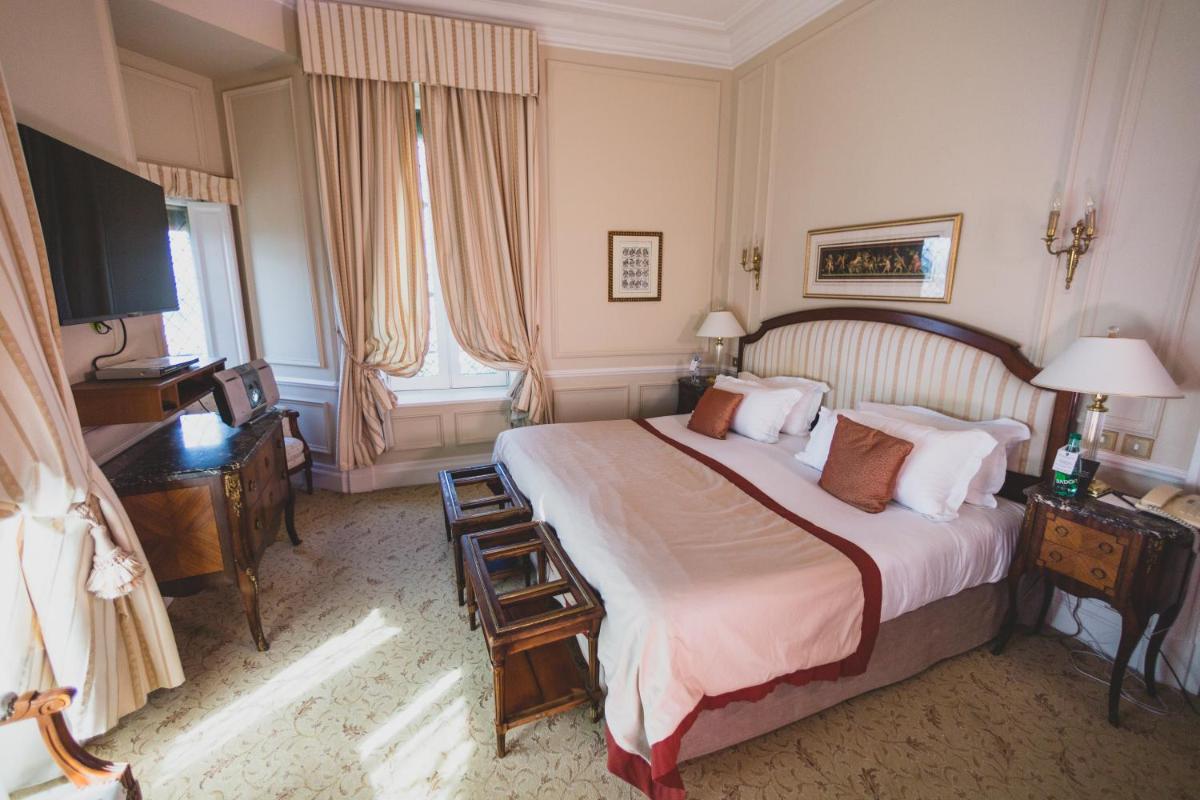 Un ou plusieurs lits dans un hébergement de l'établissement Hotel de la Cité Carcassonne - MGallery Collection