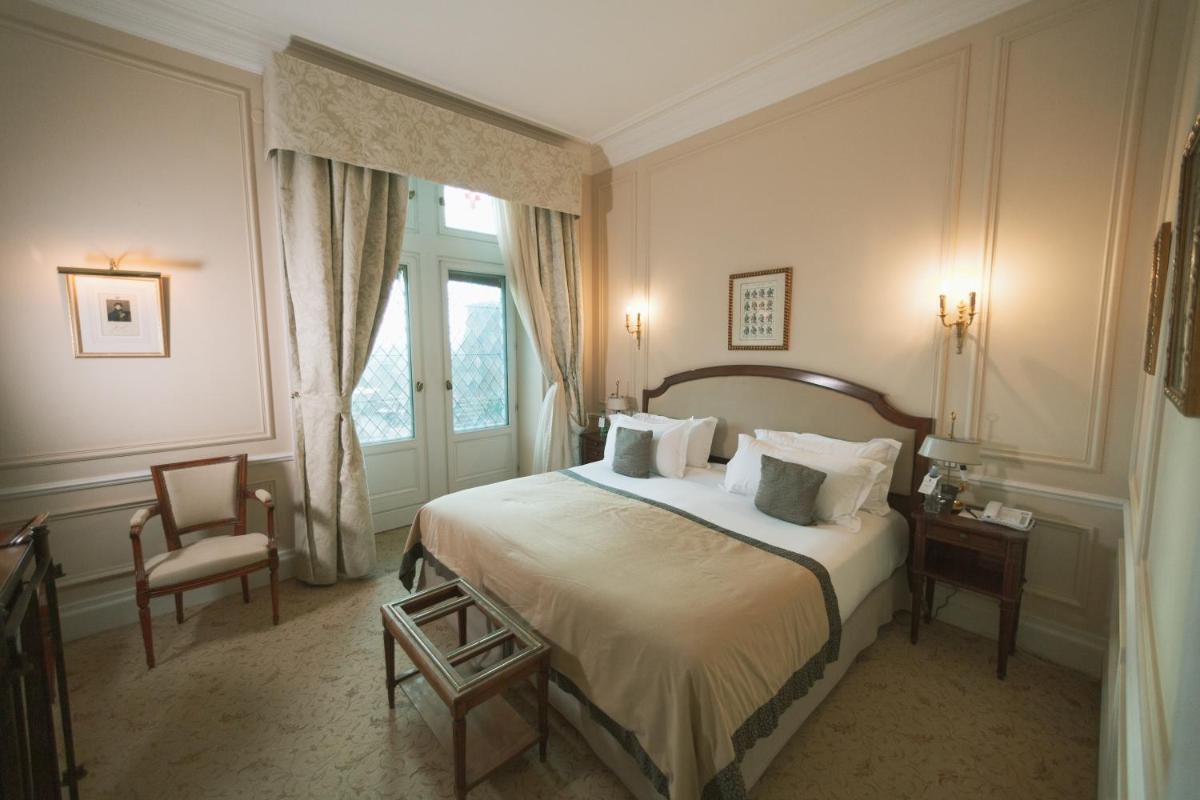 Un ou plusieurs lits dans un hébergement de l'établissement Hotel de la Cité Carcassonne - MGallery Collection